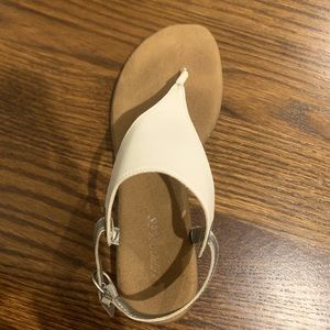These sandals are size 7 and are white.